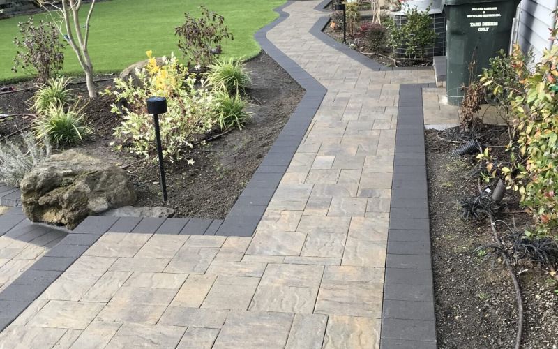 A unique walkway with pavers and concrete