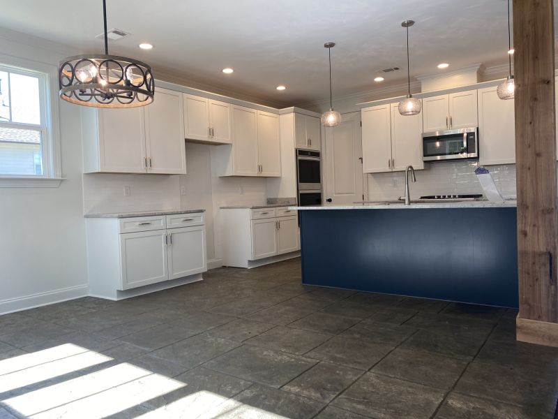 Kitchen just after the remodeling project included countertops and cabinets.