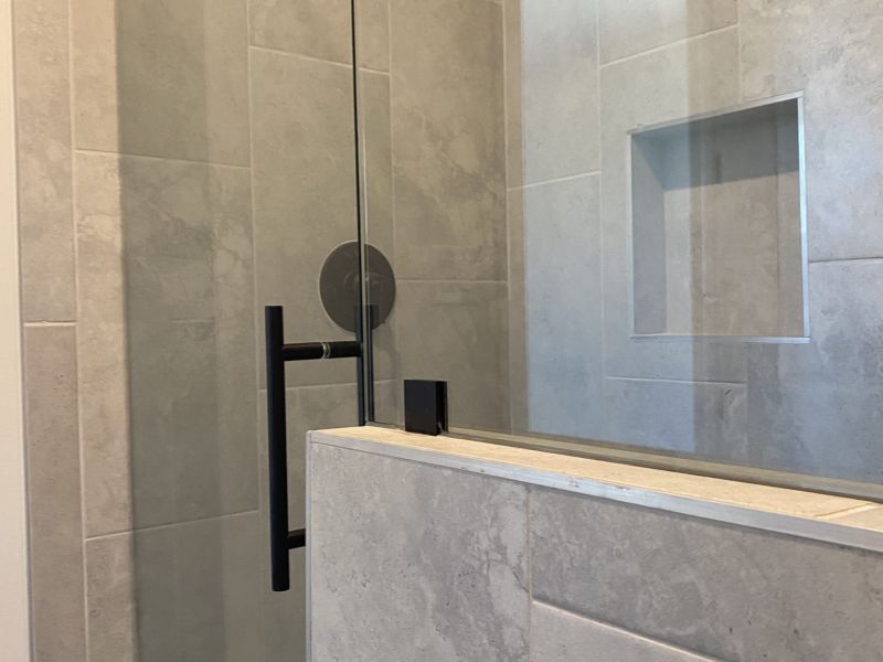 New bath remodel shoing the shower now has much more room.