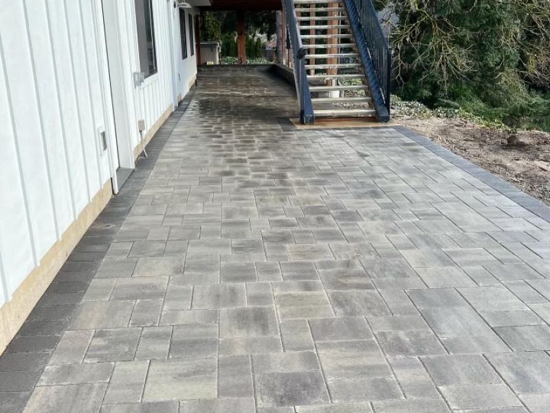 Patio with stamped concrete and paver installation.